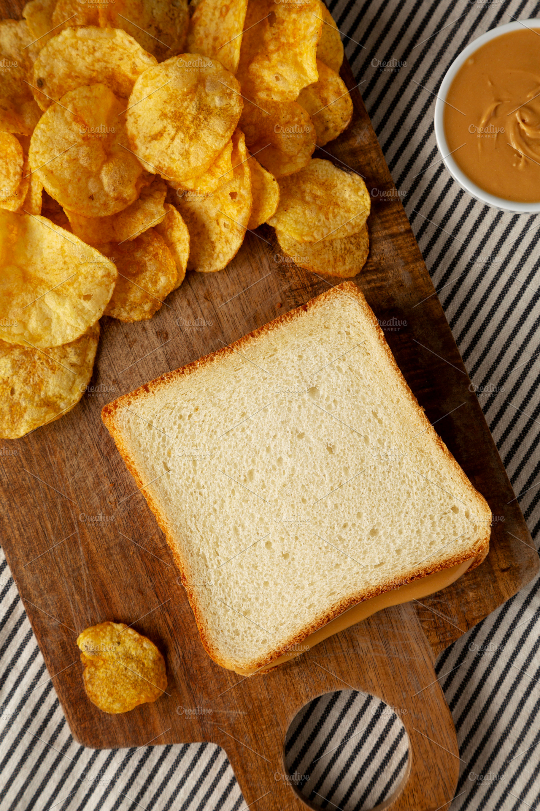 Homemade American Peanut Butter Sandwich on a Wooden Board, top, a Food & Drink Photo by LiudmylaChuhunova