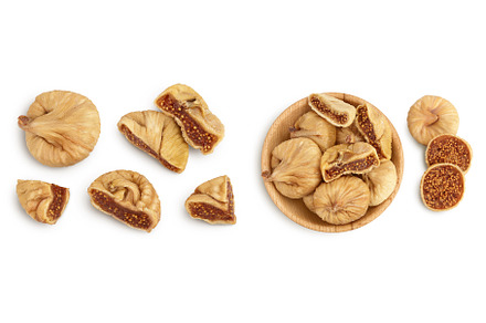 dried fig in wooden bowl isolated on, a Food & Drink Photo by NataPhoto