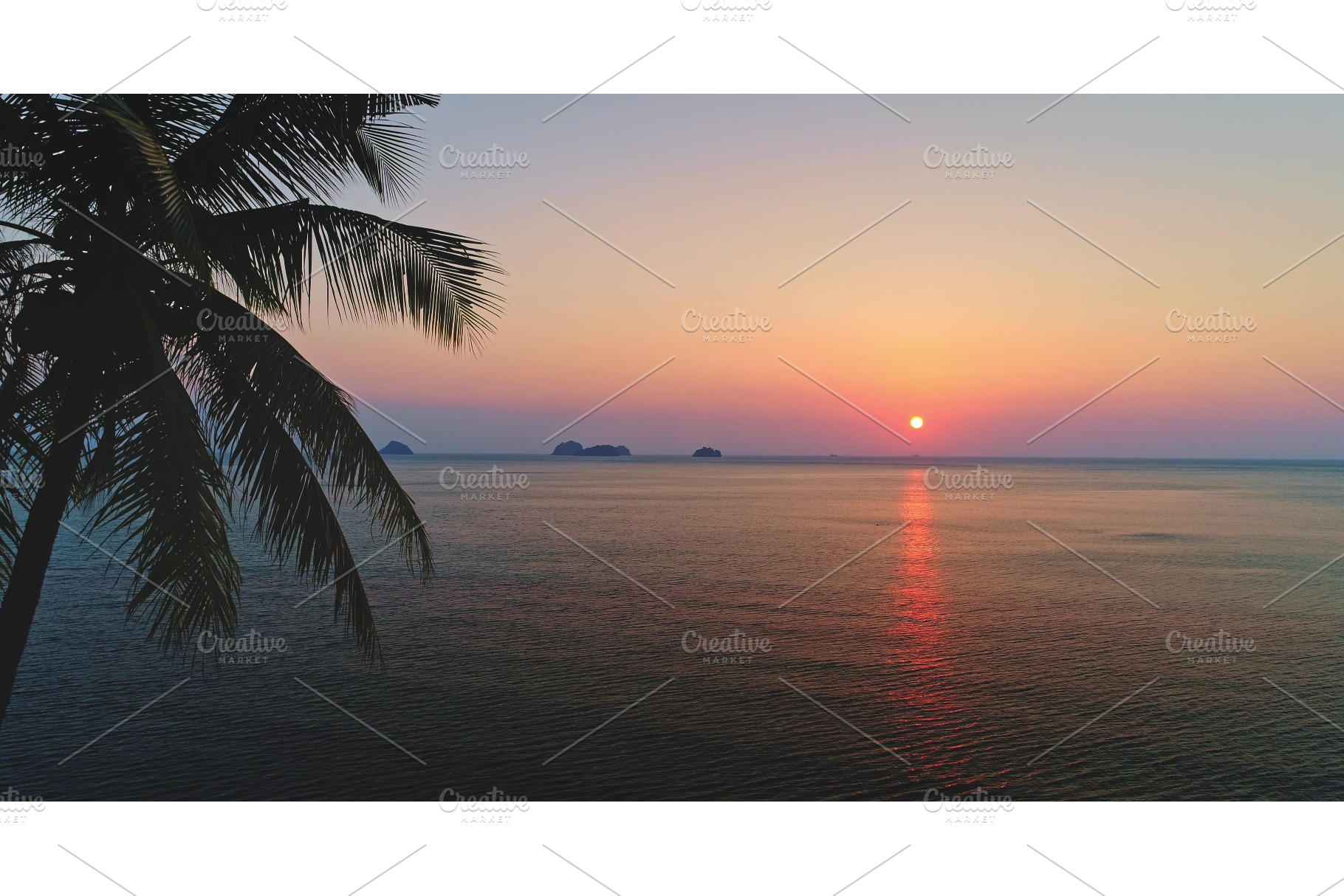 Tropical sunset over calm sea with, a Nature Photo by Goinyk