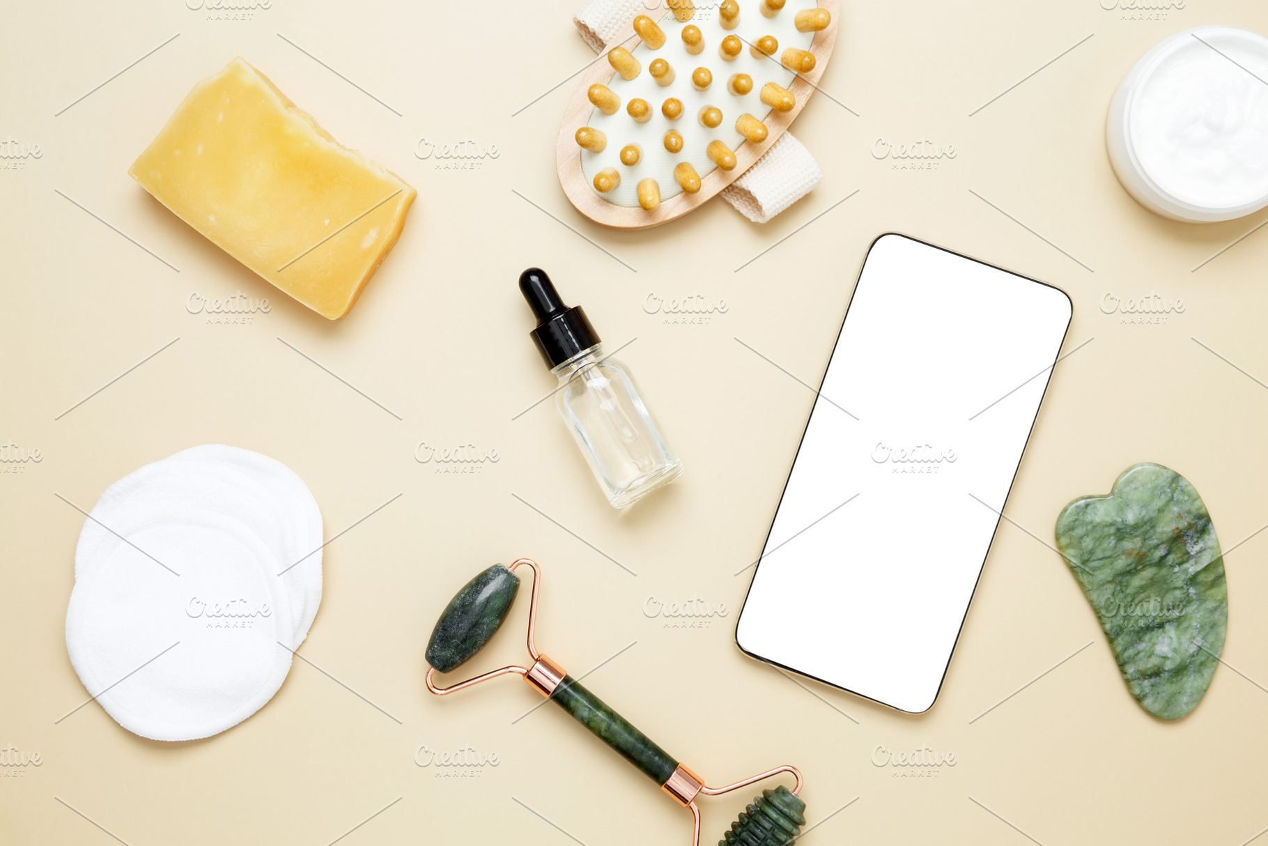 Smartphone mockup with skincare products including marble face roller, gua sha,, a Photo by matucha