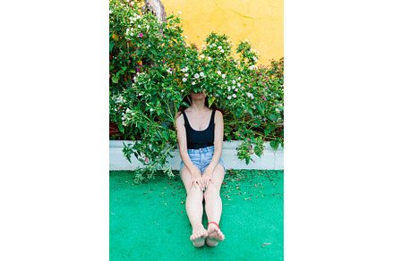 Thoughtful woman sitting alone, a Person Photo by Manu Reyes