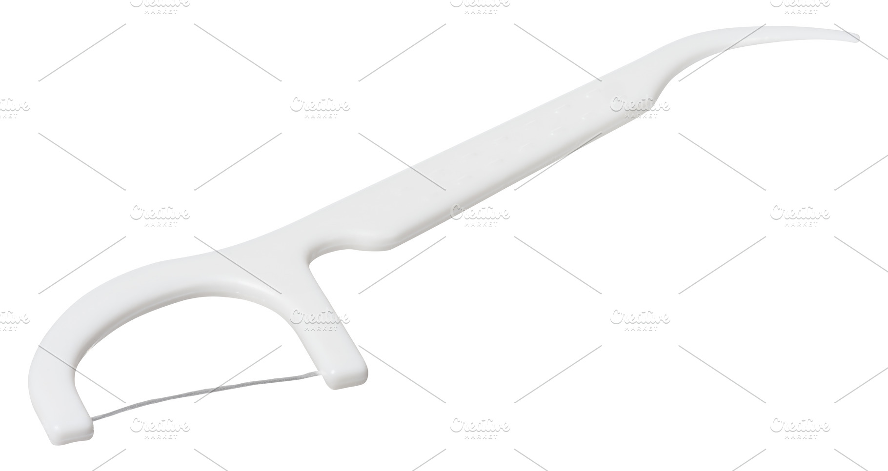 White plastic dental flosser on isolated background. Oral hygien, a Health & Medical Photo by ndanko