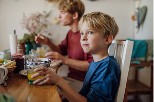 Family eating breakfast together in, a Food & Drink Photo by HalfPoint
