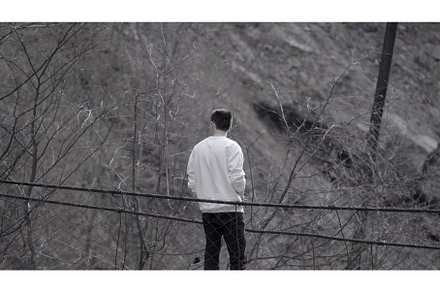 Rear view of a man standing at the, a Nature Photo by Media Whale Stock