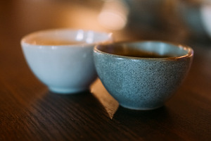 Sake cup serving alcoholic drink asian clay bowls, a Food & Drink Photo by Photo Drive Studio