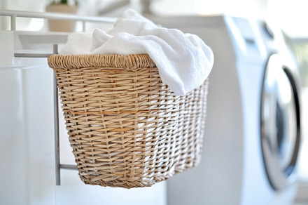 Laundry basket with clean towels on, a Photo by Iftikhar Alam