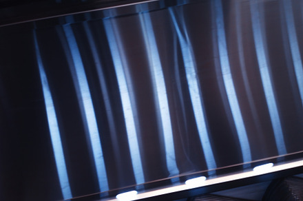 Dramatic light reflections on metal surface backdrop