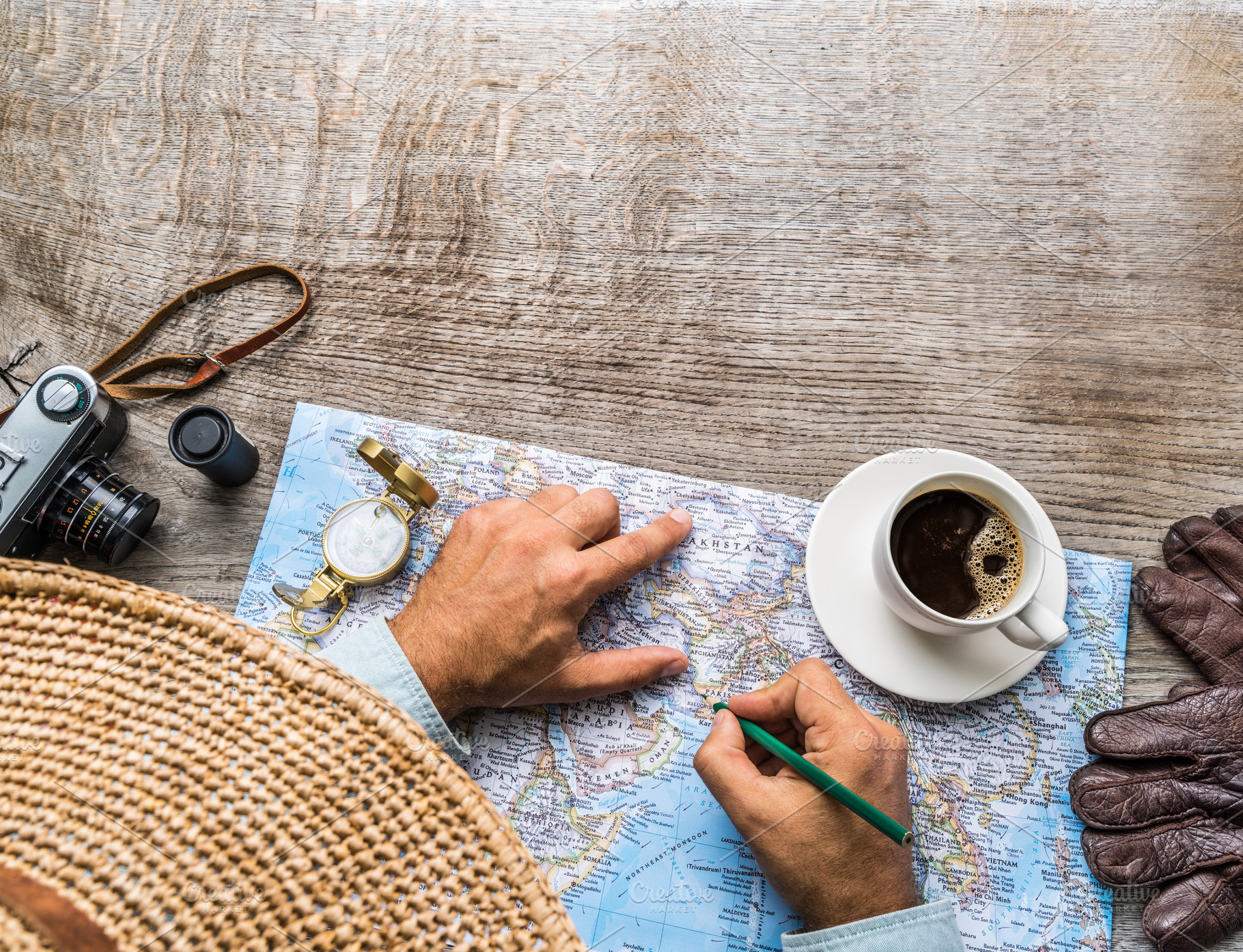 Man looking for new travel destinations on the world map., a Holiday Photo by Volff