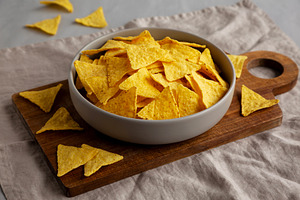 Homemade Tortilla Corn Chips in a Bowl, side view., a Food & Drink Photo by LiudmylaChuhunova