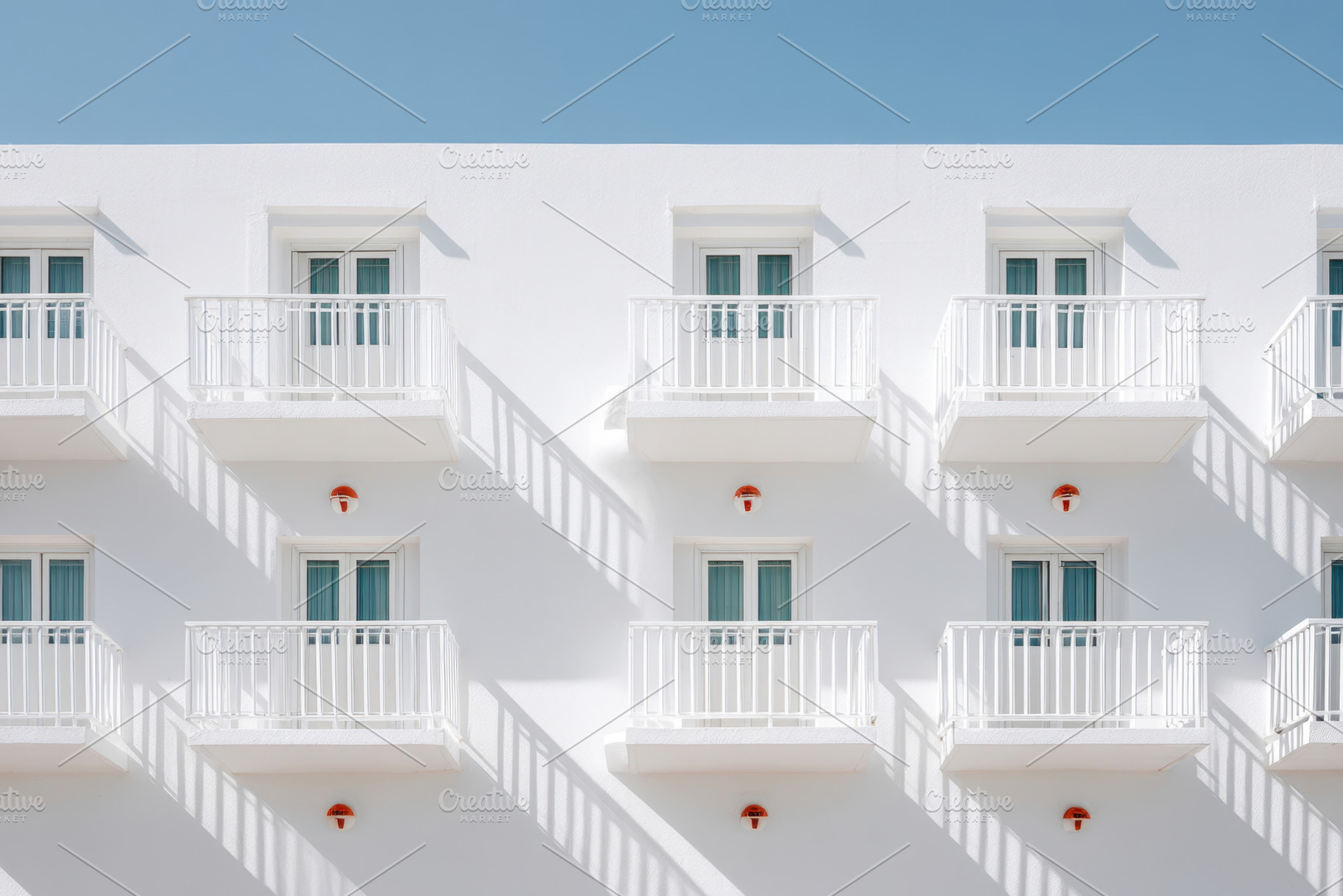 Modern white building with balconies, an Architecture Photo by AlyaAnd