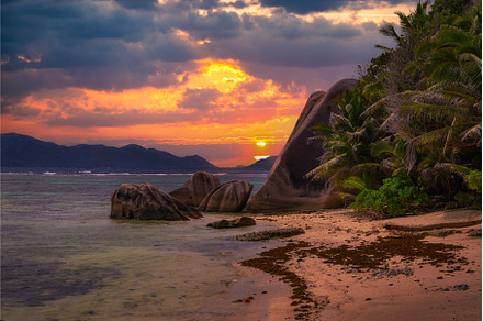 Colorful sunset over Anse Source D, a Nature Photo by Nick Fox