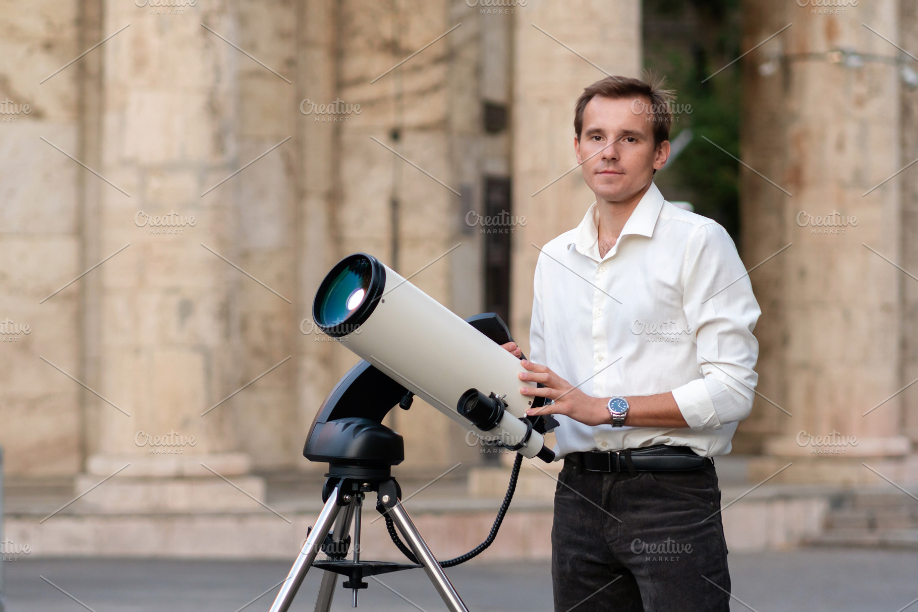 Man adjusting telescope for astronom, a School & Education Photo by Elena Vagengeim
