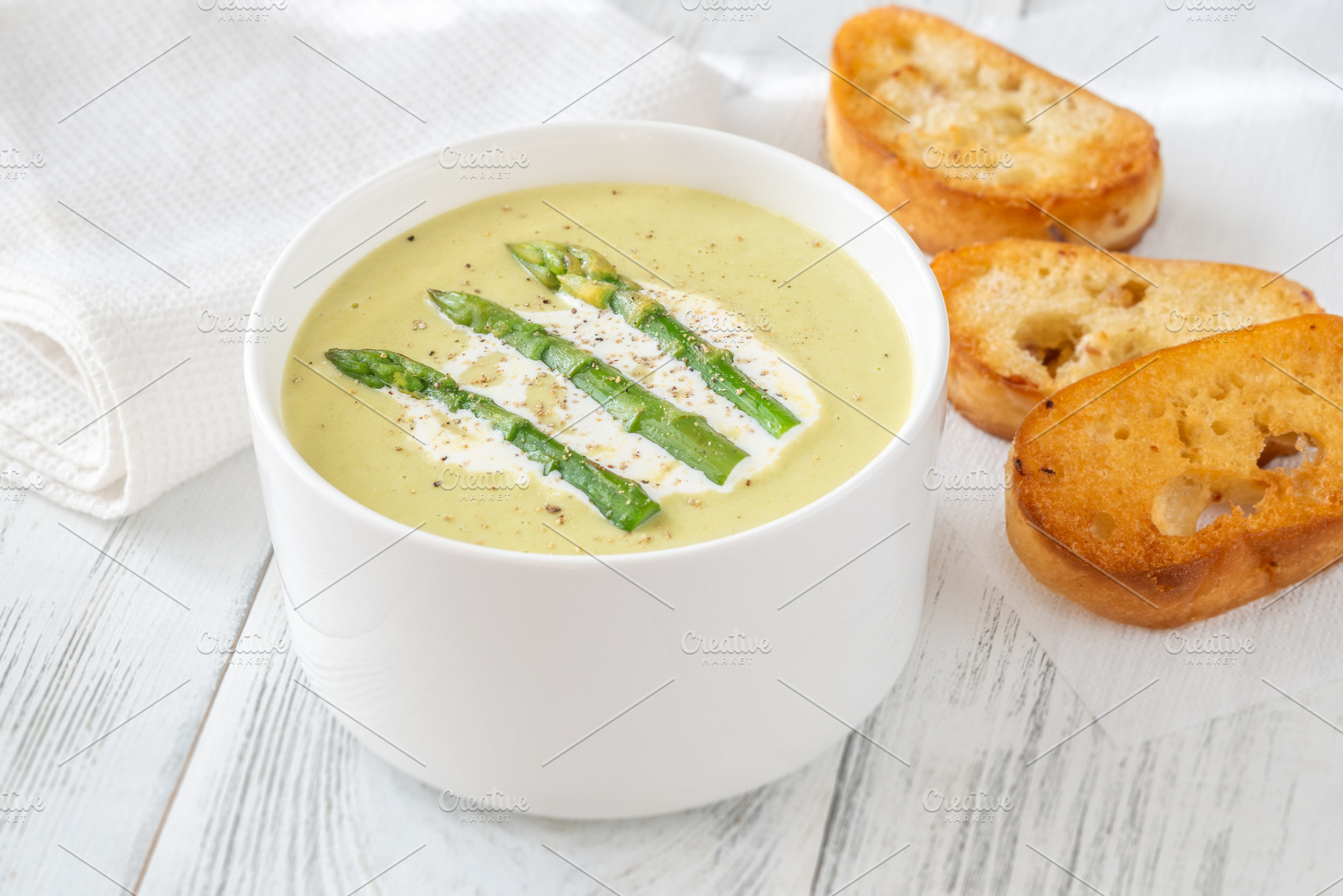 Creamy asparagus soup in white bowl, a Food & Drink Photo by Alexander Prokopenko