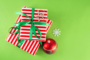 Bright high-colored background with Christmas boxes, festive bau