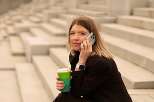 Young woman talking on phone, a Person Photo by Elena Vagengeim