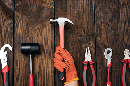 A set of construction tools on a brown wooden background, top vi, an Industrial Photo by ndanko