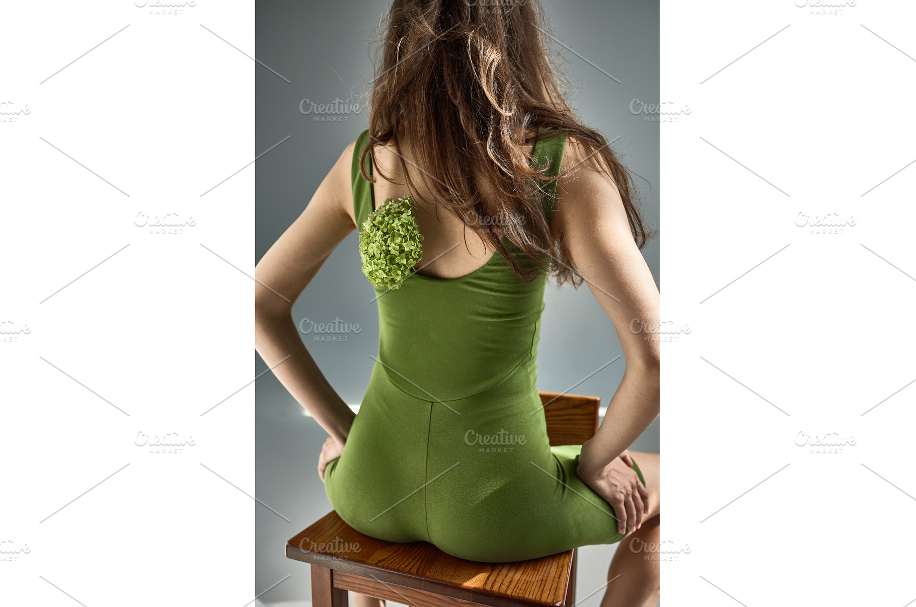 Elegant woman in green dress sitting, a Nature Photo by wip3out