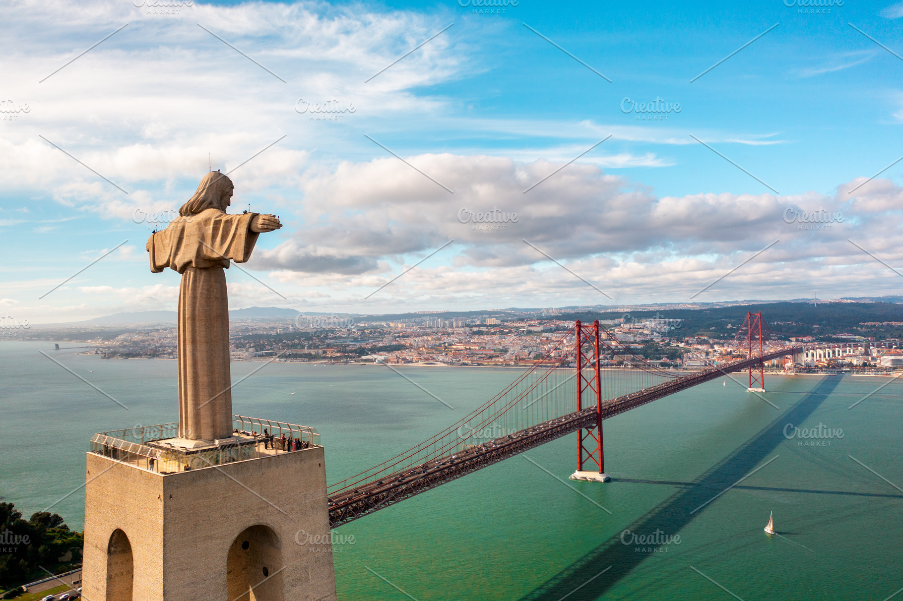 Sanctuary of Christ the King with 25 de Abril Bridge over Tagus river, a Photo by andreonegin market