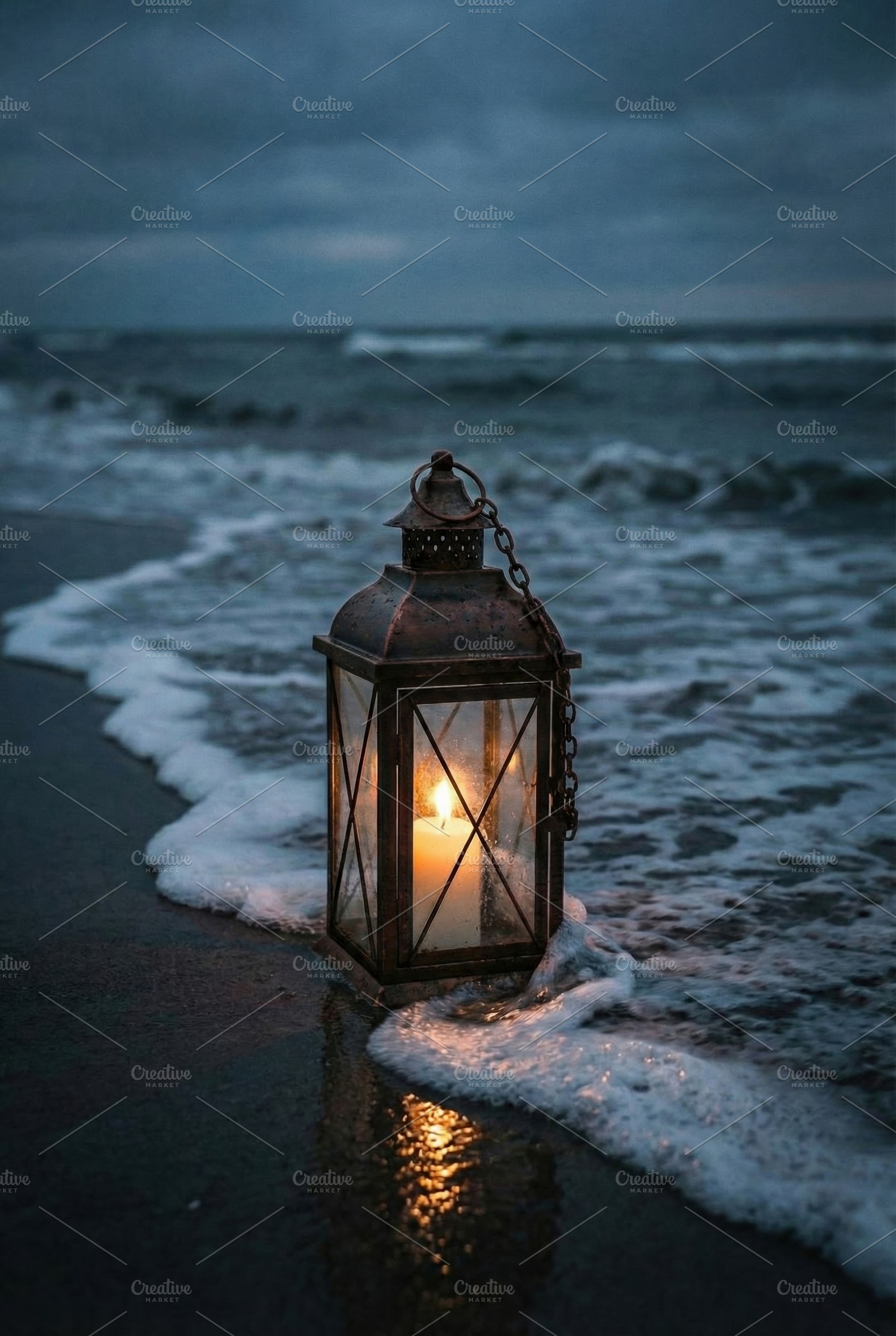 Lit Candle Lantern on Beach, a Nature Photo by Virgo Studio