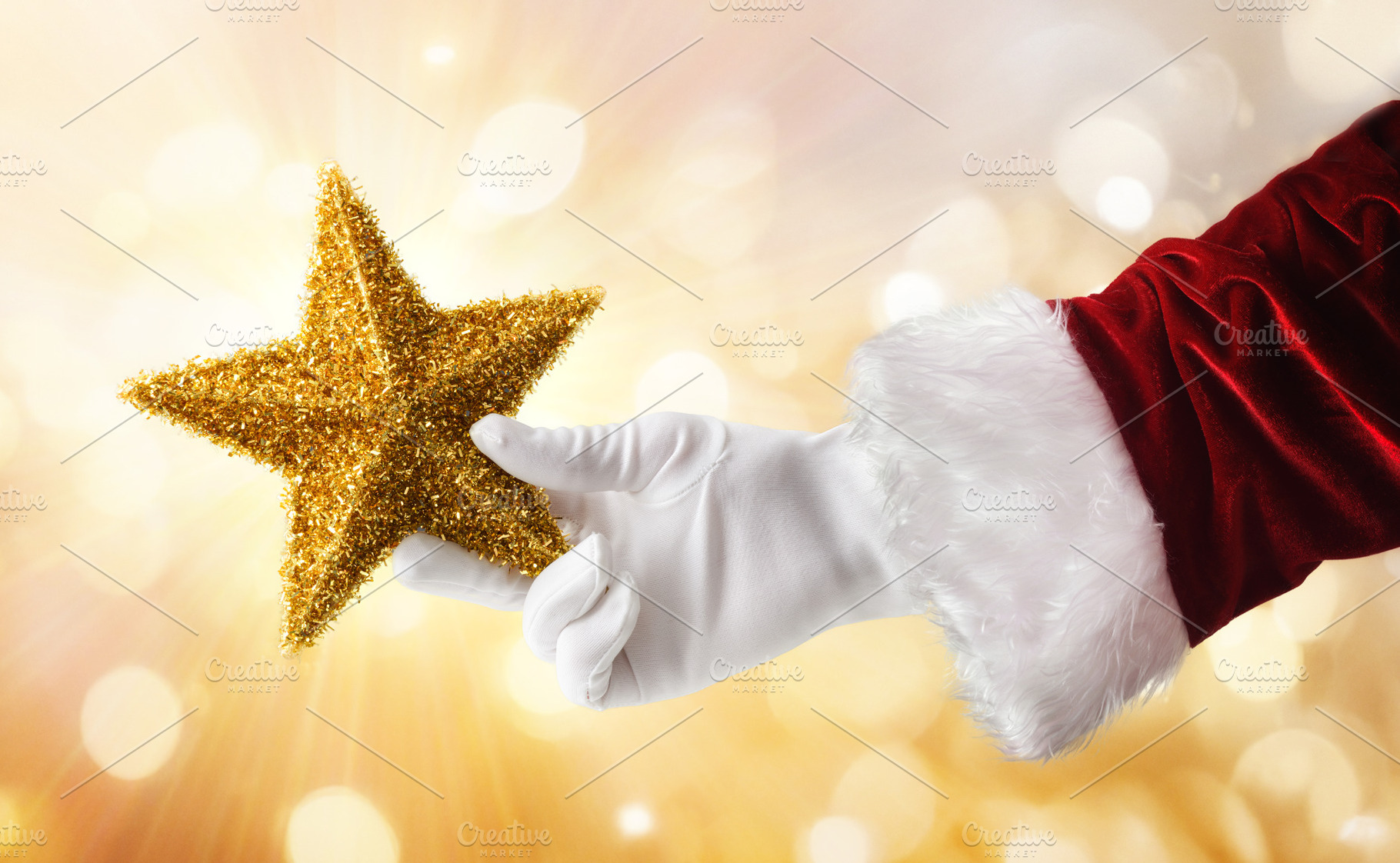 Christmas season with Santa's hand with star and gold bokeh, a Holiday Photo by Davizro's Market
