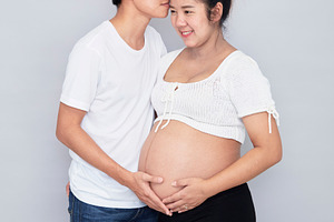 portrait of a happy pregnant wife with her husband
