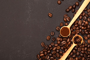 Ground coffee and beans in wooden, a Food & Drink Photo by Anna Efetova