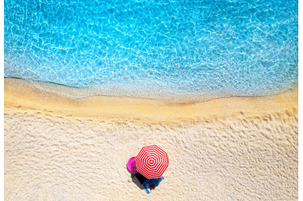 Aerial view of red umbrella, sandy, a Nature Photo by den-belitsky