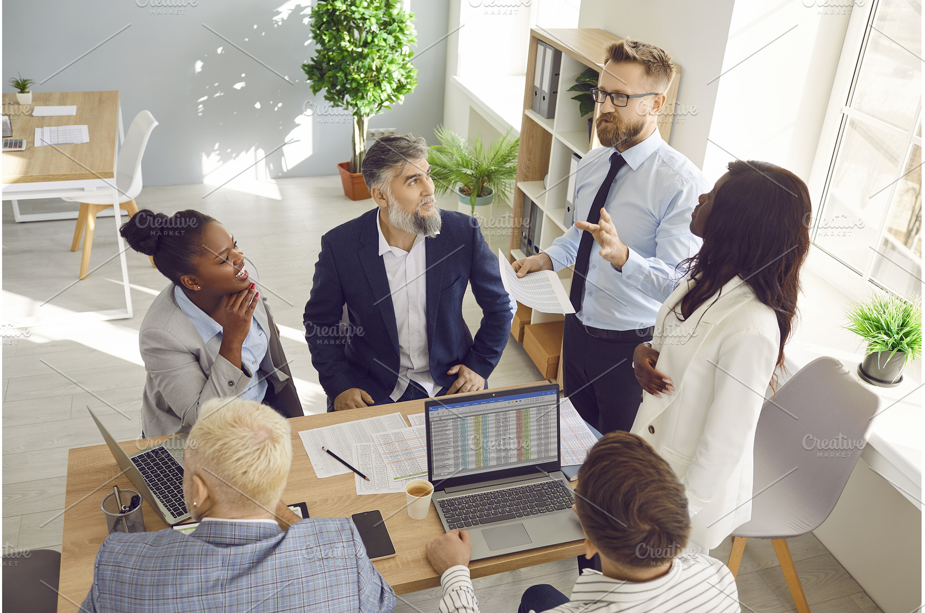 Group of business people talking on, a Person Photo by StudioRomantic