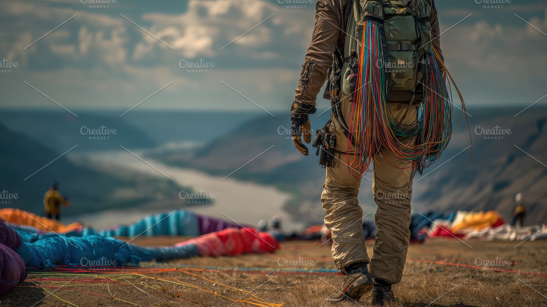 Paraglider walking away from colorfu, a Photo by Pixeness Studio