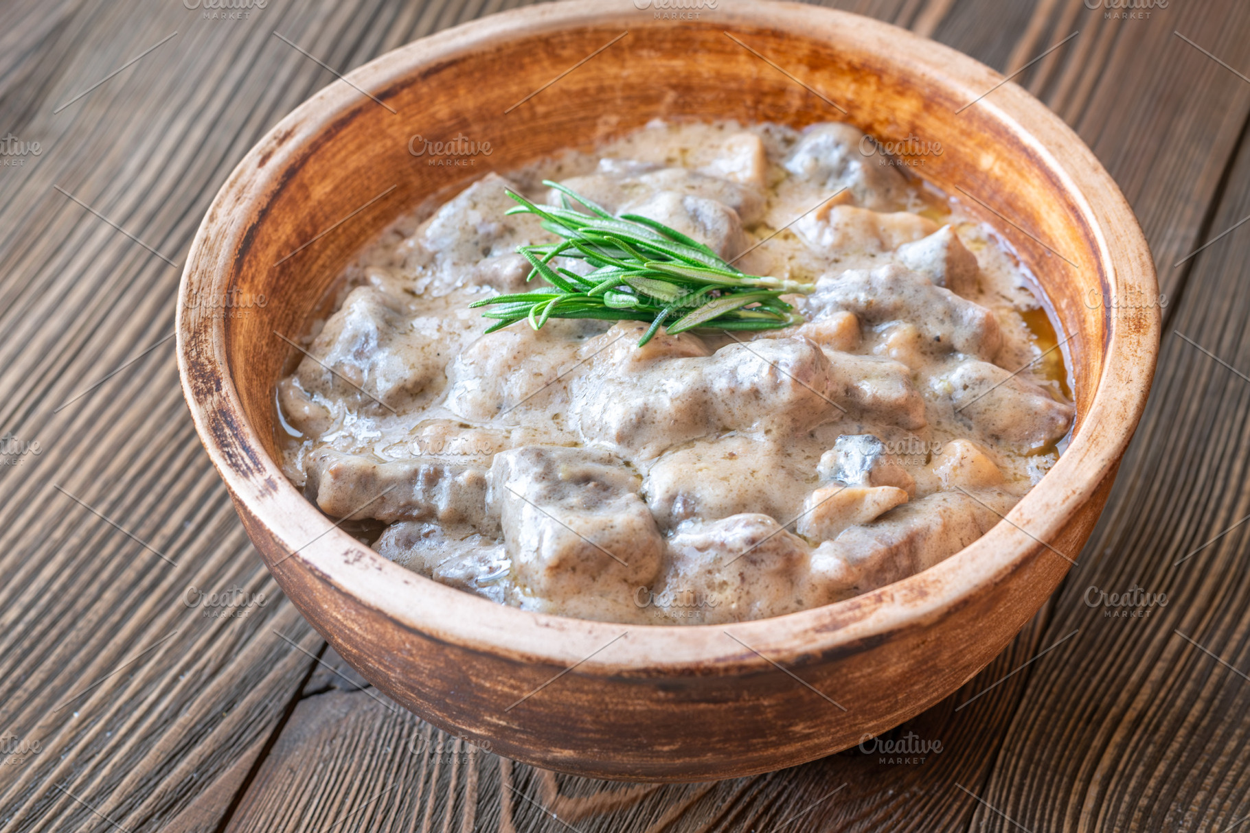 Hearty beef stroganoff in rustic bow, a Food & Drink Photo by Alexander Prokopenko