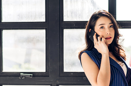 Portrait of smiling happy beautiful asian woman relaxing using d, a Person Photo by Art_Photo