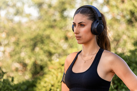 Focused Woman with Headphones in Out, a Sports & Recreation Photo by Perpis