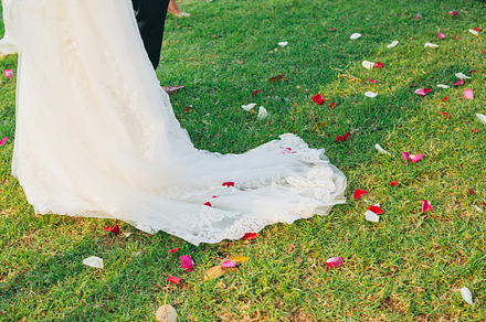 Bride walks on rose petals