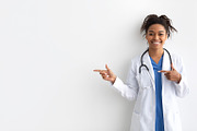 Portrait of black doctor smiling and posing to camera, a Photo by Prostock-Studio (Thumbnail 1 of 2)