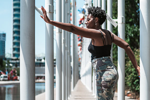 Dancer Between Flagpoles, a Person Photo by SkyNext