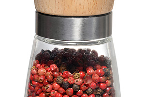 A glass spice grinder with a wooden top, containing a mixture of, a Food & Drink Photo by ndanko