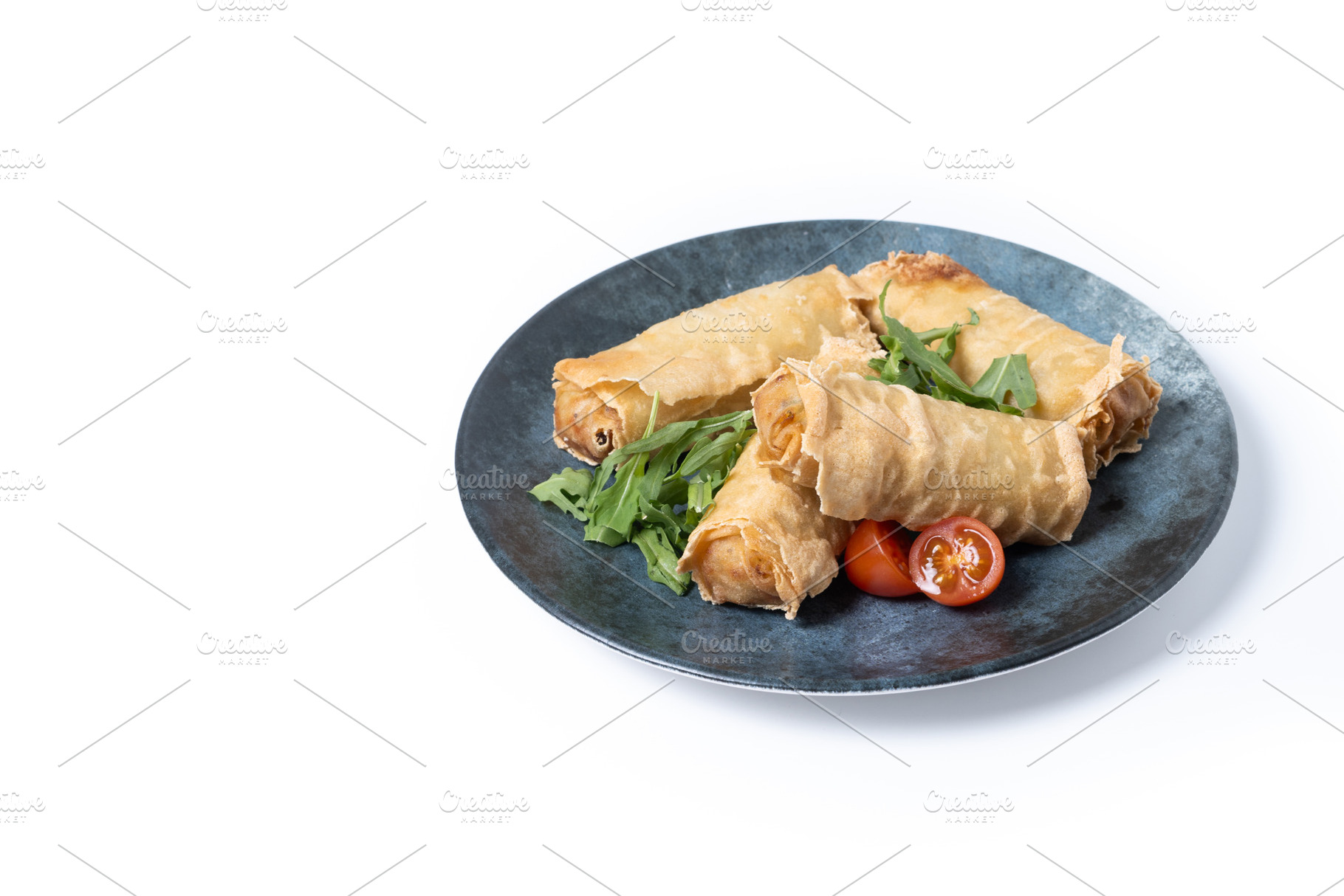 Crispy Spring Rolls on Ceramic Plate isolated on white background, a Food & Drink Photo by etorres69