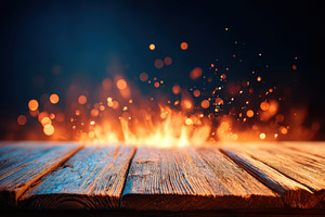 Wooden tabletop with glowing sparks on dark background, a Background Photo by AlyaAnd