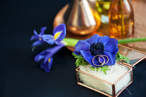 Wedding decor with blue anemones featuring table, white, and anemone