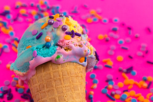 A Scoop of Unicorn Colored Ice Cream in a Cone