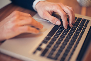 Hands on the keyboard stock photo containing computer and laptop