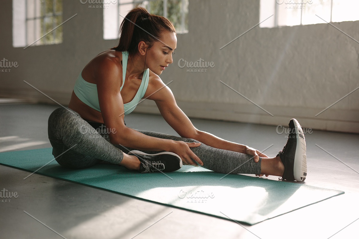 Fit woman doing stretching workout containing athlete, body, and exercise, a Sports & Recreation Photo by Jacob Lund (Photo 2 of 2)