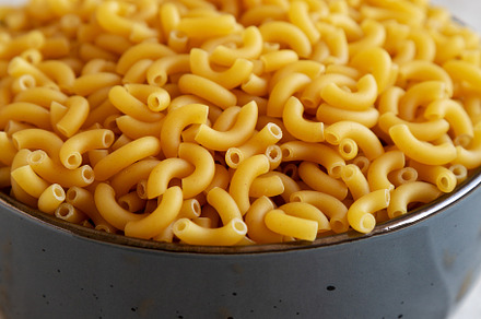 Bowl of Dry Organic Macaroni Elbow Pasta, Ready to be Cooked. Cl, a Food & Drink Photo by LiudmylaChuhunova