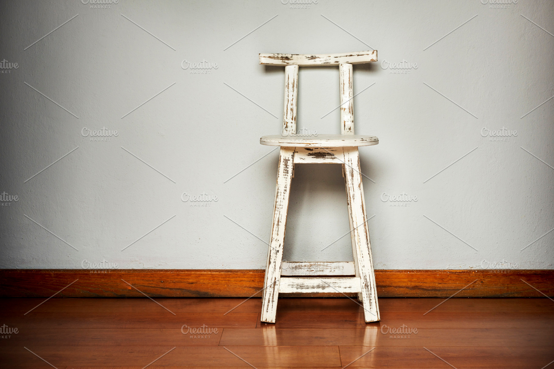 White Wooden Stool Against Wall, an Architecture Photo by THP Creative