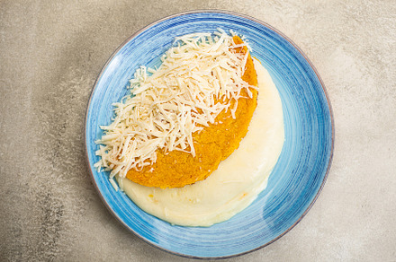 Arepa stuffed with cheesel, traditional cuisine of Colombia and Venezuela, a Food & Drink Photo by zakiroff