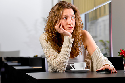 Young woman is waiting for someone featuring adult, alone, and attractive, a Person Photo by sergeypeterman