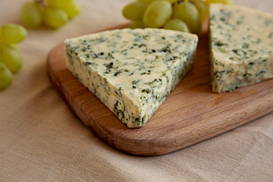 Delicious Cheese Danablu on a wooden board, side view., a Food & Drink Photo by LiudmylaChuhunova