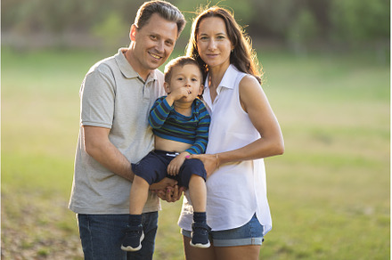Cute white parents holding their, a Person Photo by Barcelona_dreams
