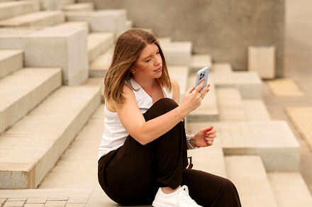 Young woman sitting on steps