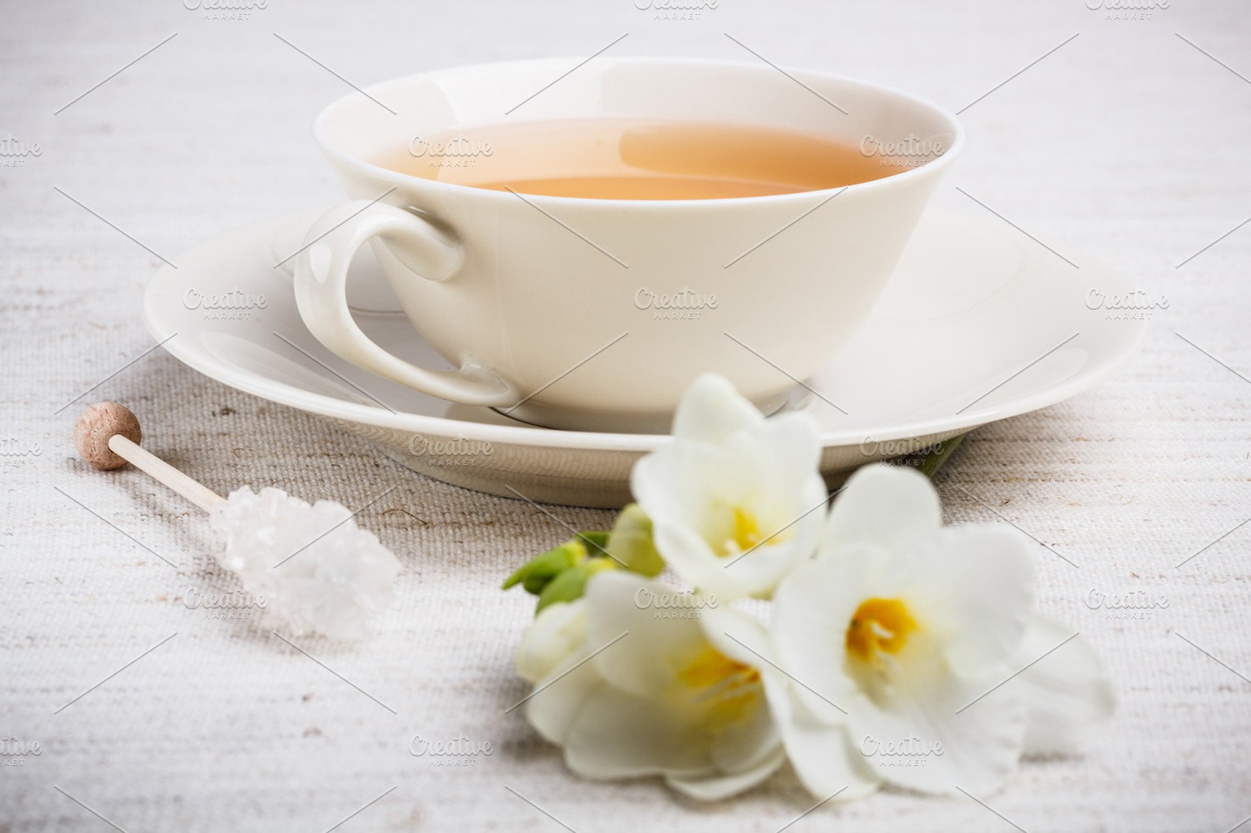 Cup of tea featuring tea, afternoon, and flower
